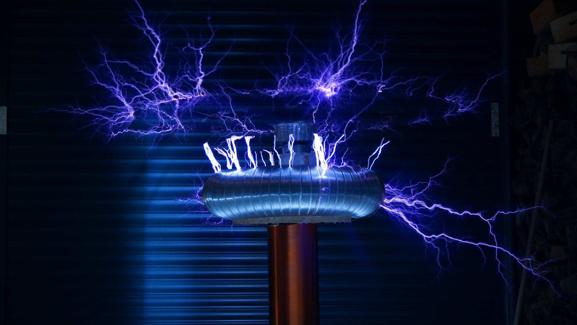A photo of a Tesla coil, a tool that converts electrical power into visible fingers of light, similar to lightning