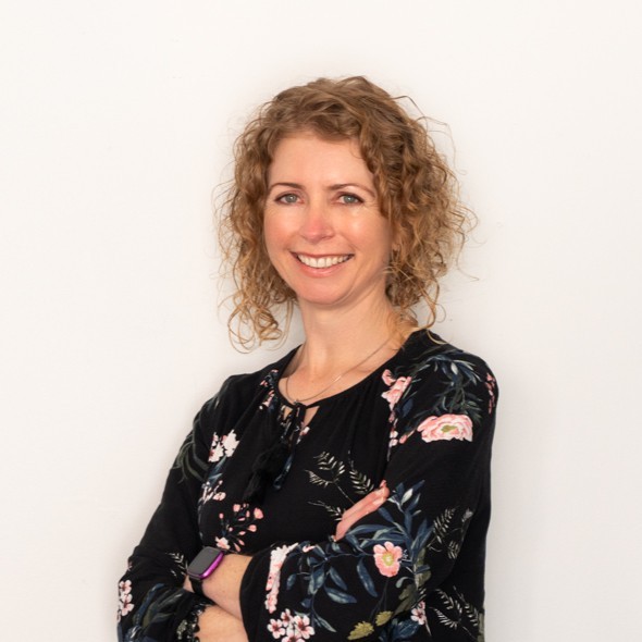 A woman smiling at the camera