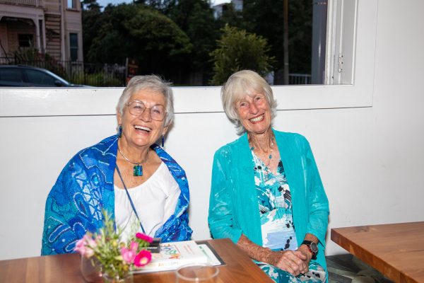 Two women smiling at the camera