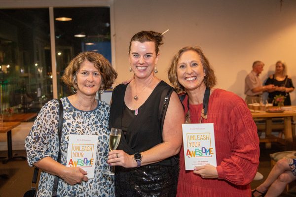 A group of women smiling at the camera