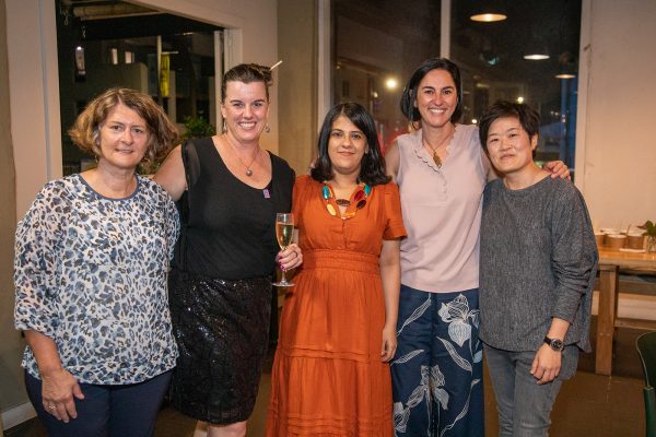 A group of women smiling at the camera