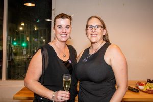 Two women smiling at the camera