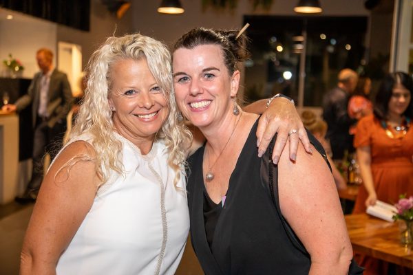 Two women smiling at the camera