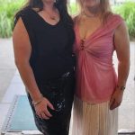 Two women smiling at the camera